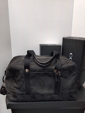 Coach Black Signature Canvas Travel Bag  No. F77286 FIRM/PRICE
